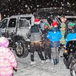 Volunteers work in the snow