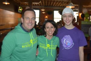 Michael, Gina and Sam pose together in Bridge Builder and Relay for Life attire