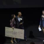 Check presentation onstage with Justin Rose and Gina