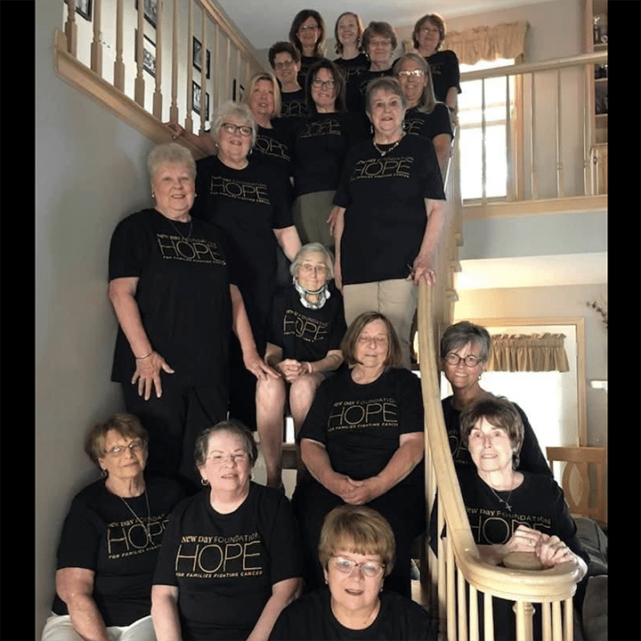 Volunteer group photo in New Day shirts