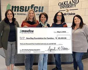 Five people with large check presentation at MSUFCU