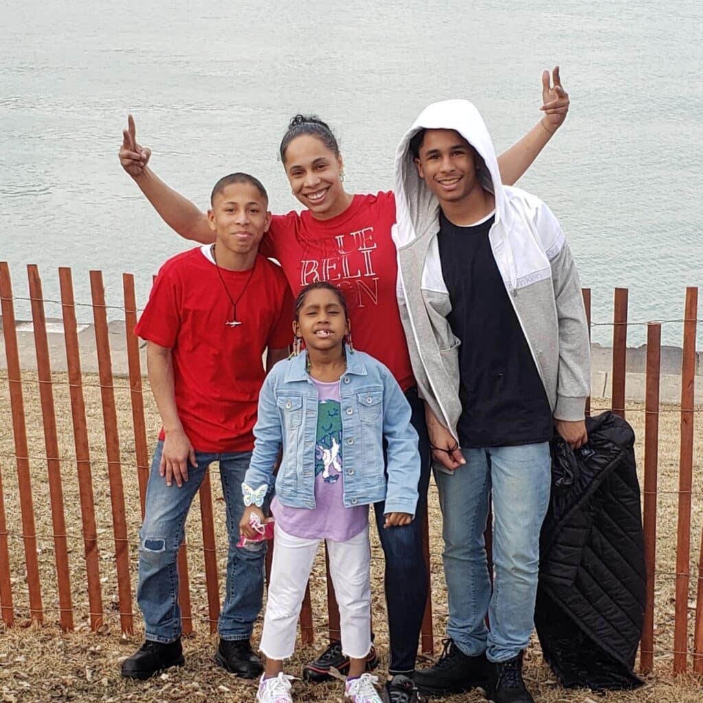 New Day family from Gr Rapids pose together outdoors